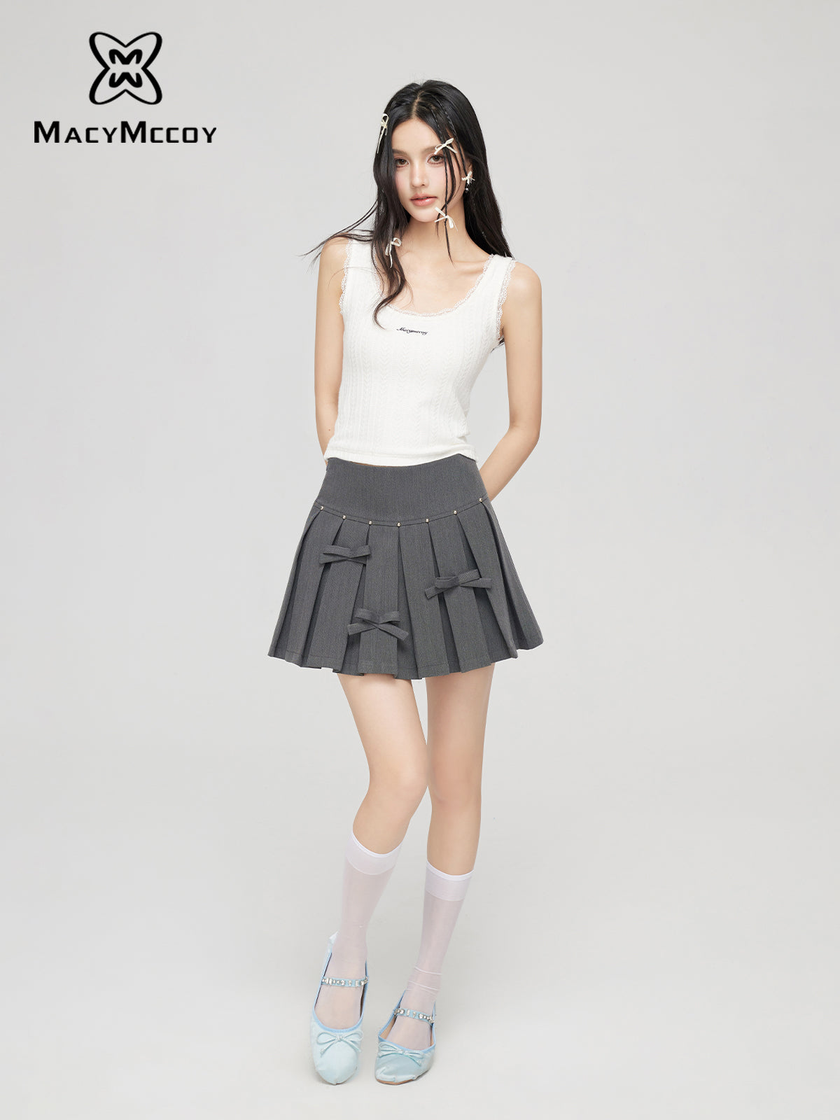 Pleated mini skirt with small bows MAC0047